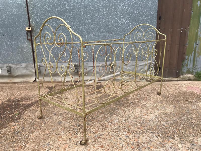 Victorian large cast iron cot on castors