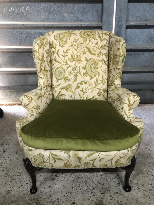 French Queen Anne style wing back chair with embroidered upholstery.