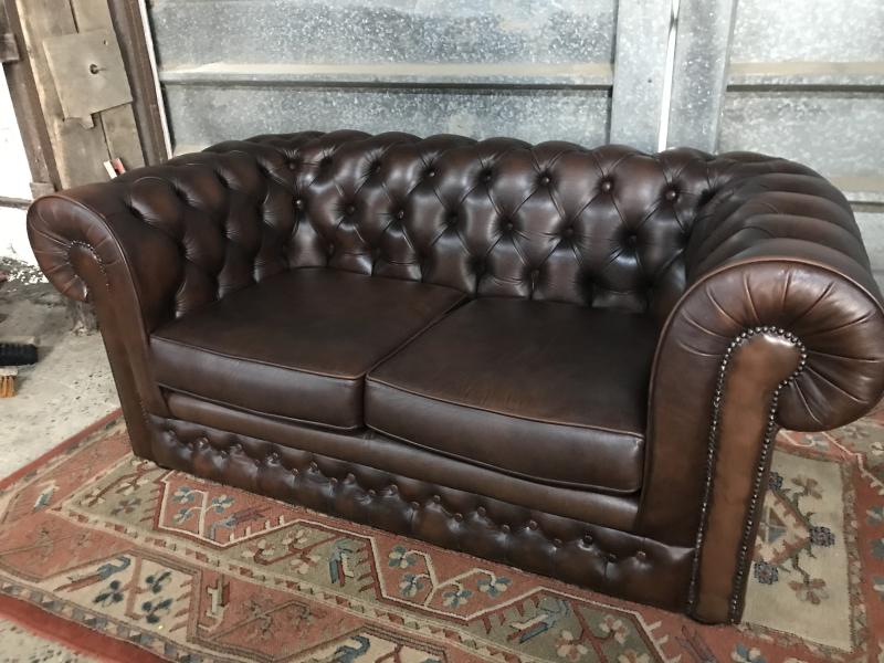 Thomas Lloyd brown leather chesterfield.